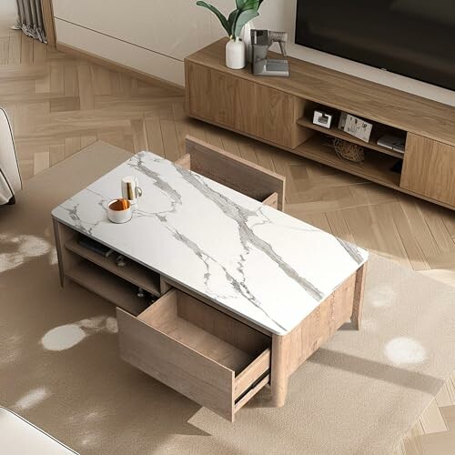 Modern living room with marble-top coffee table and wooden furniture.