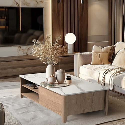 Modern living room with marble coffee table and neutral decor.