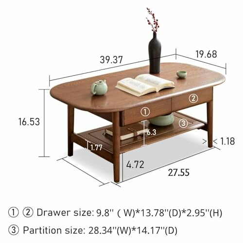 Wooden coffee table with dimensions and open book, vase, and teacups on top.